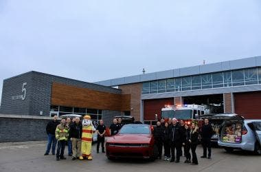 new Dodge Charger and Chrysler Pacifica minivans deliver $20,000 worth of new toys on behalf of employees at Stellantis' Windsor plant for “Sparky's Toy Drive.”